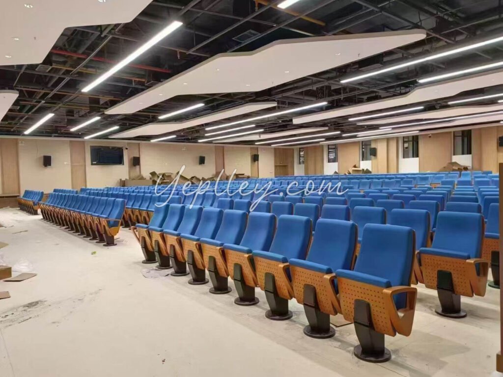 fixed base one leg auditorium chair with molded foam seat and wooden backrest