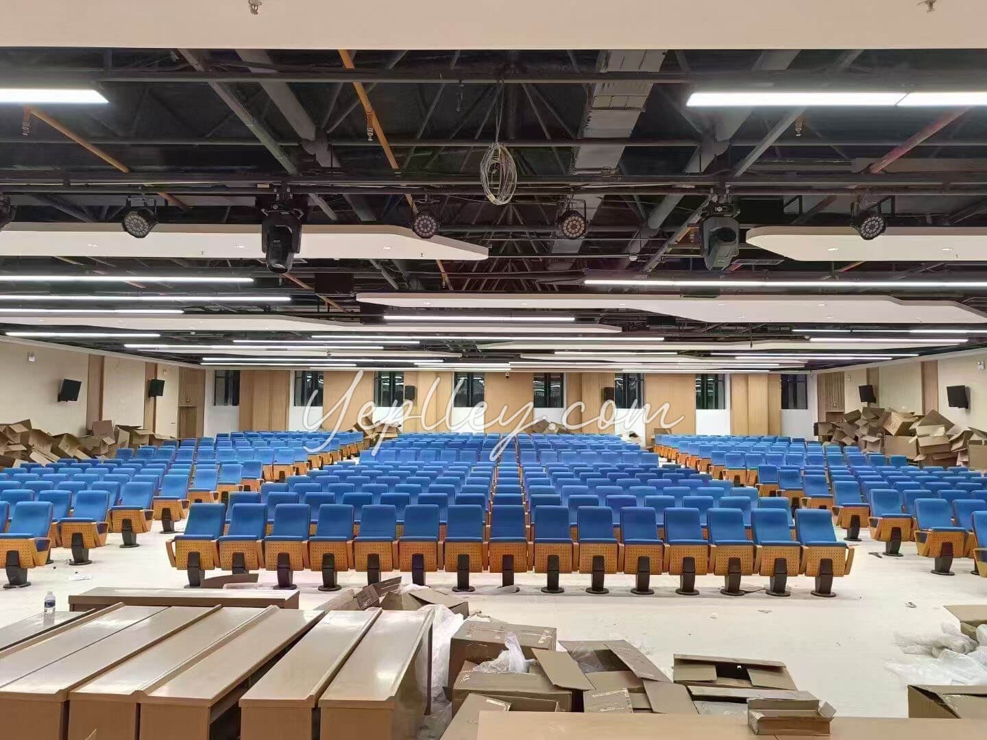 single pedestal auditorium chair with plywood back and upholstered seat