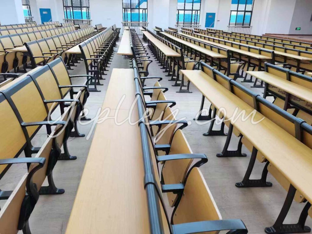 Fixed seating with foldable writing tablets for auditorium use