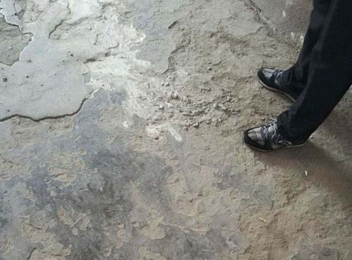 Rough concrete ground surface showing bumps and holes, not recommended for installing auditorium seating