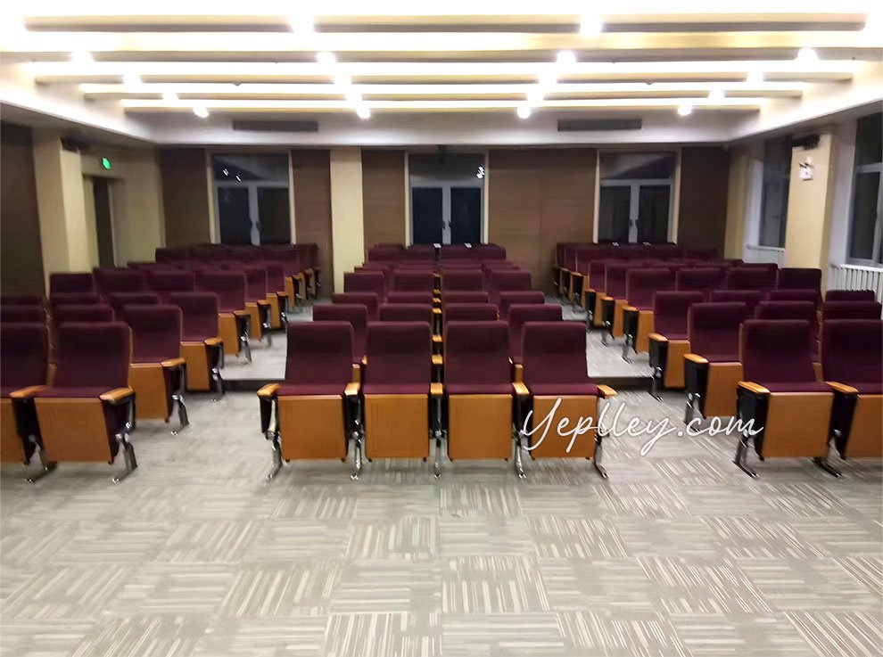 Aluminium-leg theatre seating in rows – side angle installation photo