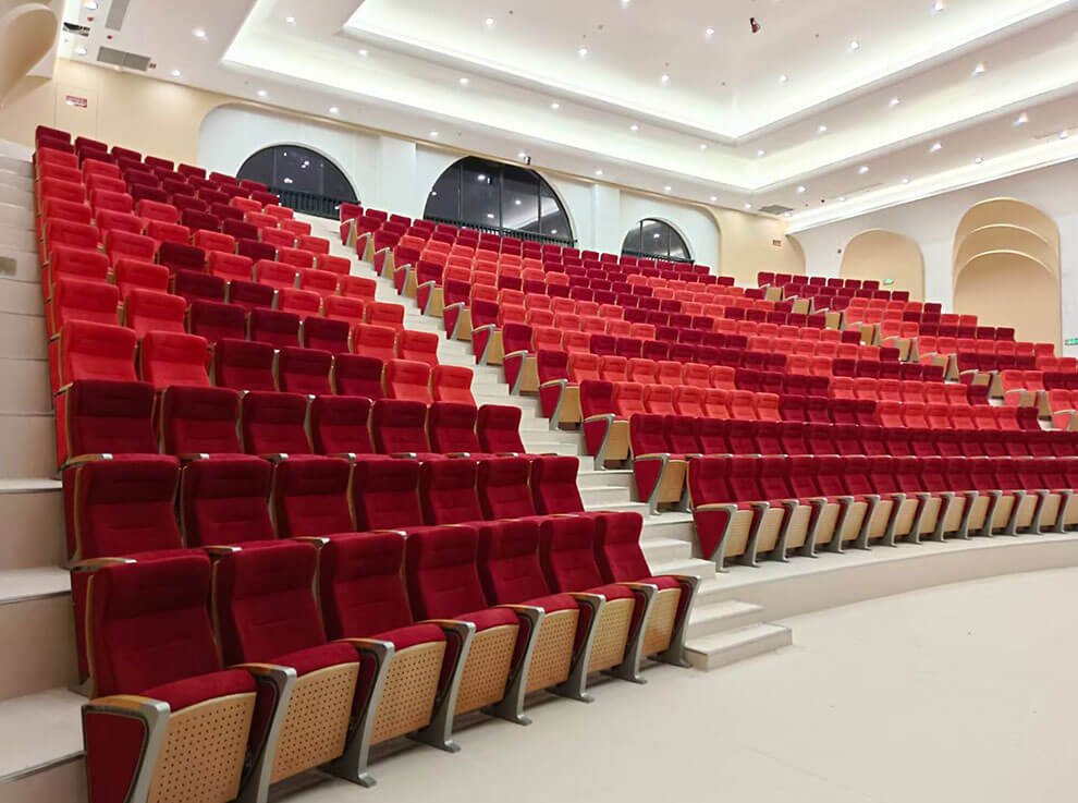 Side profile of Kunming University auditorium chairs, highlighting the patented, durable aluminum alloy leg design.