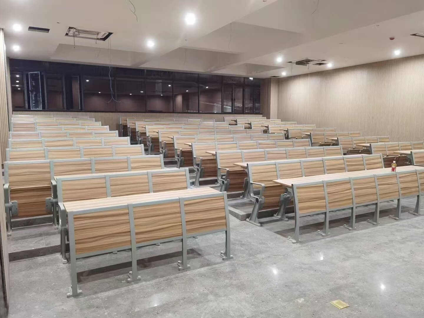 Fixed training chairs installed in stepped conference room