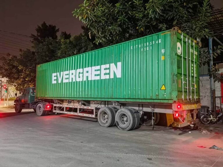 Night-time container loading of airport bench shipment in China factory