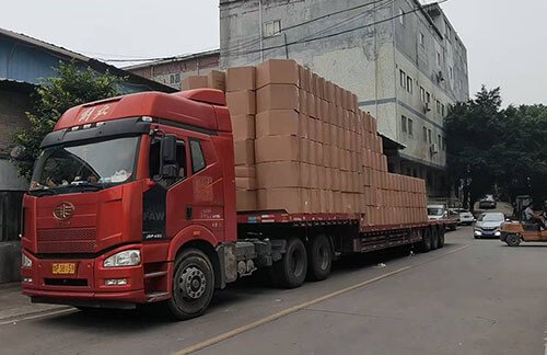 School staff assembling classroom tables and chairs for the new term