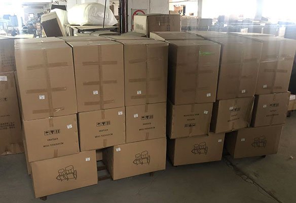 packed auditorium and airport seating products stored in warehouse awaiting shipment