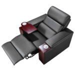 Commercial movie theater seating with leather recliners and swivel table